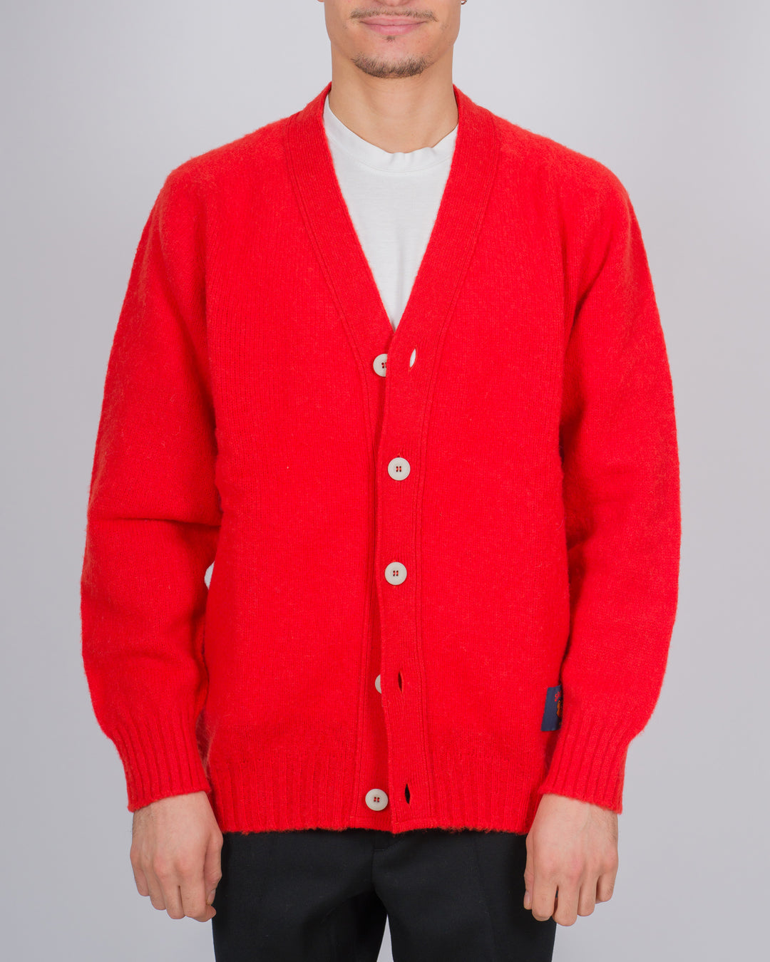Cardigan in lana scozzese con chiusura a bottoni colore corallo 
