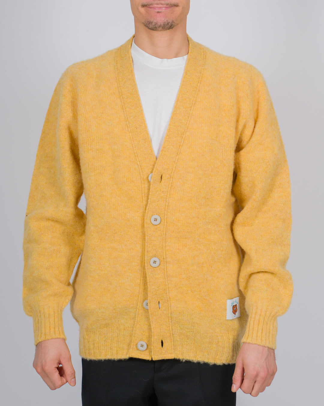 Cardigan in lana scozzese con chiusura a bottoni colore giallo 