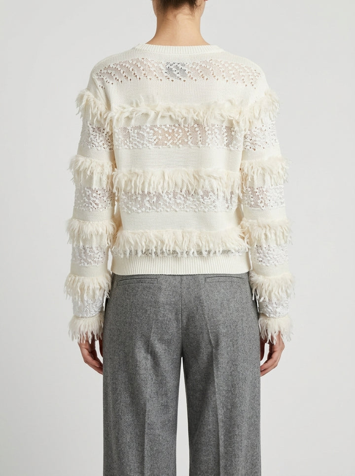 Pullover girocollo panna con  trasparenze e frange 