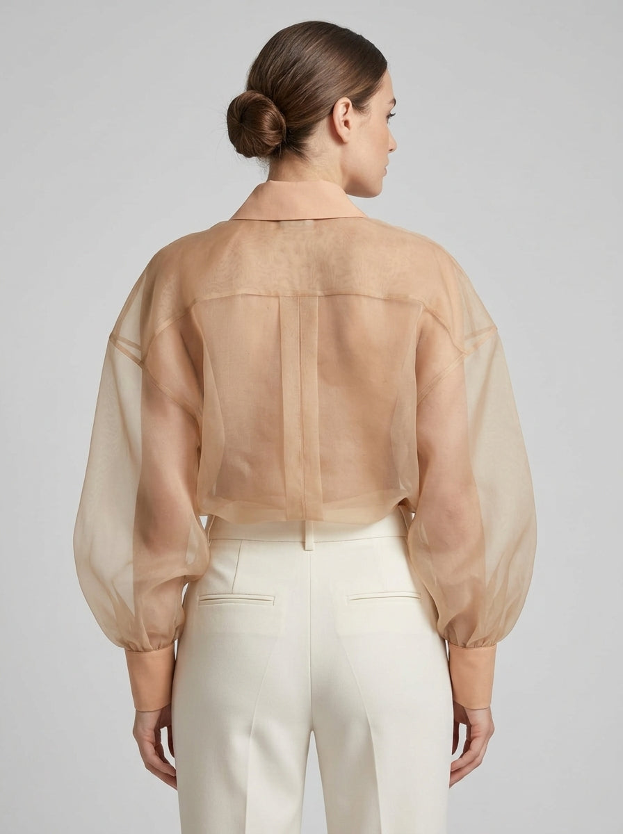 Camicia  in organza nude con maniche a sbuffo 