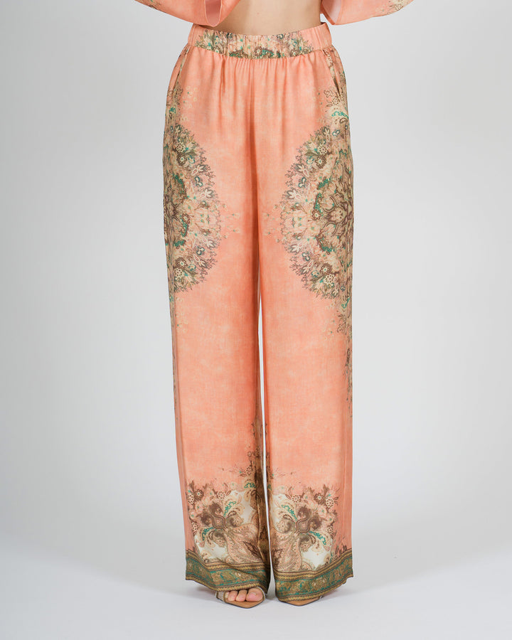 Pantalone amosa arancio in raso modello palazzo con stampa 