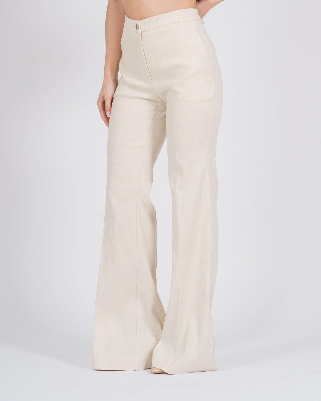 Pantaloni a zampa con finitura metallizzata panna 