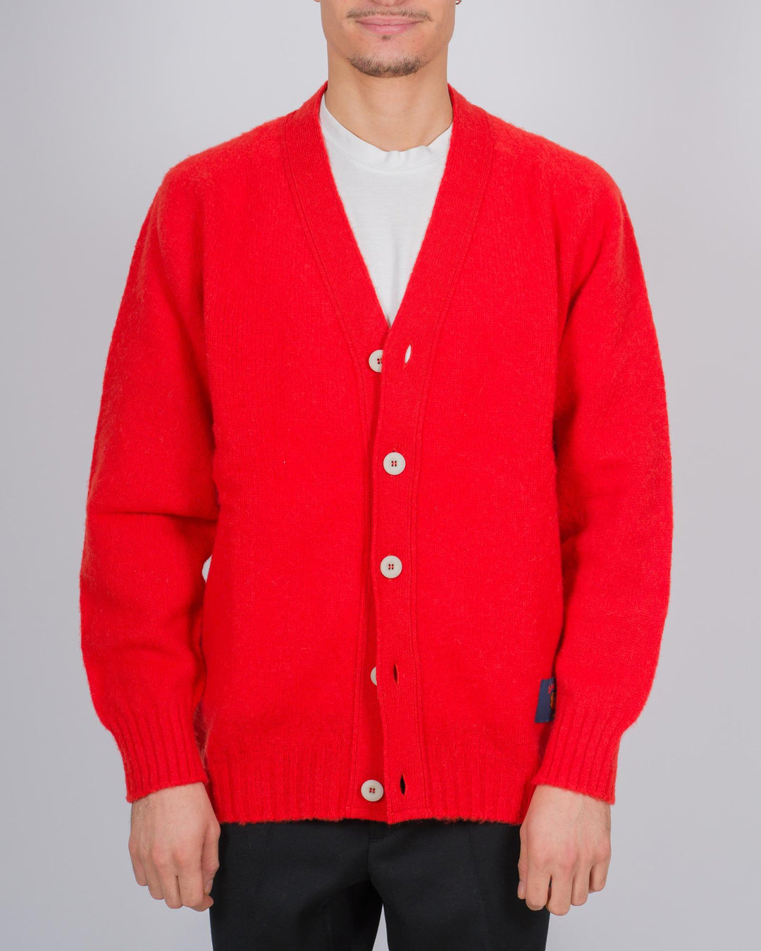 Cardigan in lana scozzese con chiusura a bottoni colore corallo 