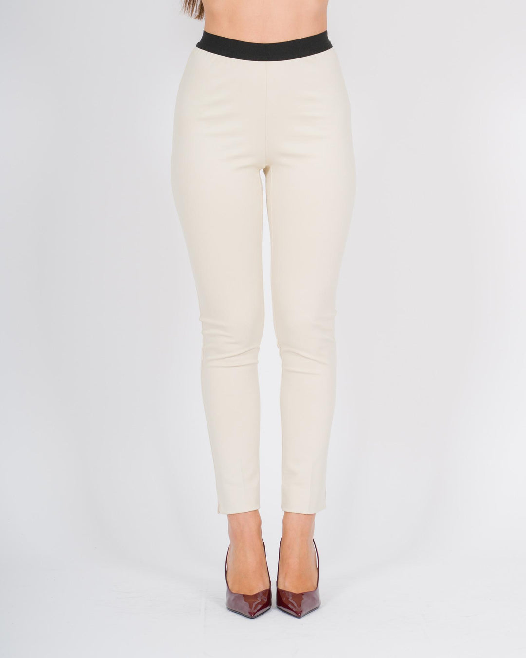 Pantalone bianco skinny con bustino in contrasto 