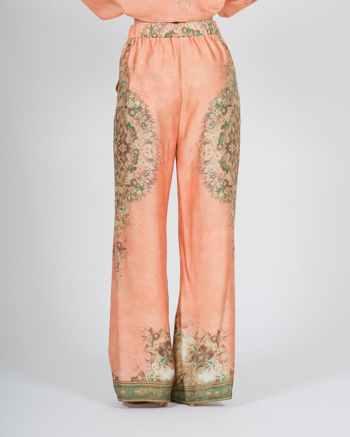 Pantalone amosa arancio in raso modello palazzo con stampa 