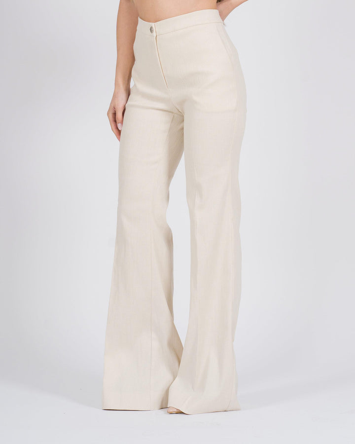 Pantaloni a zampa con finitura metallizzata panna 