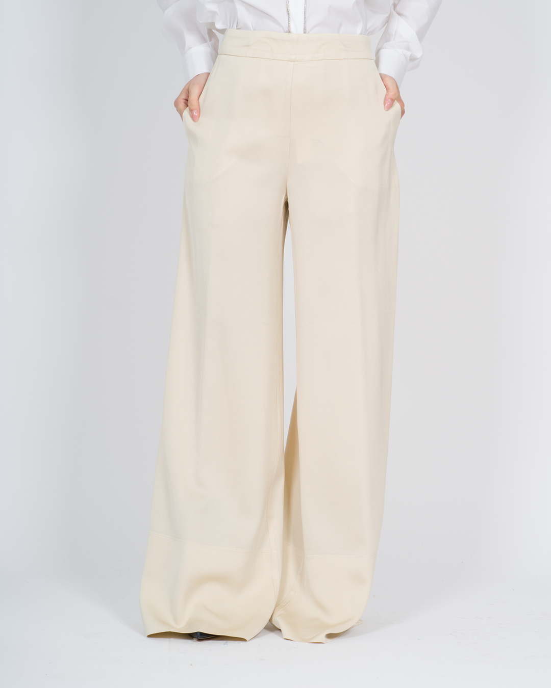 Pantaloni con cuciture decorative panna 