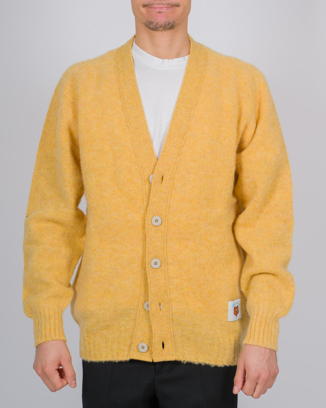 Cardigan in lana scozzese con chiusura a bottoni colore giallo 