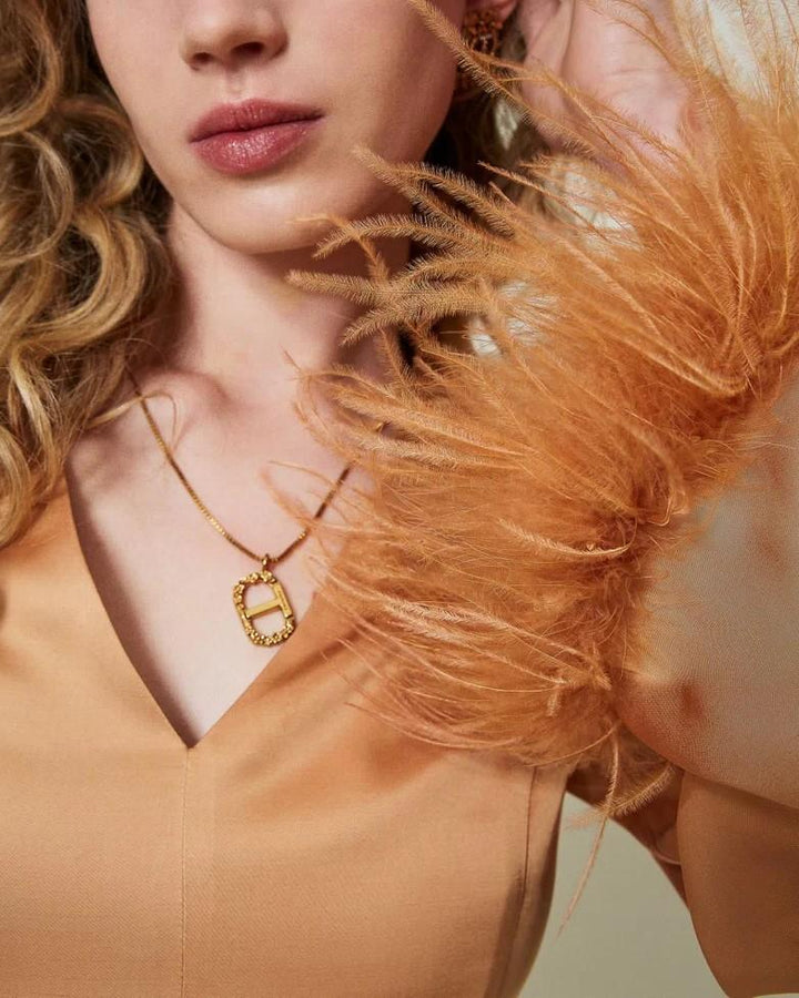 Abito lungo in raso con piume Arancio 