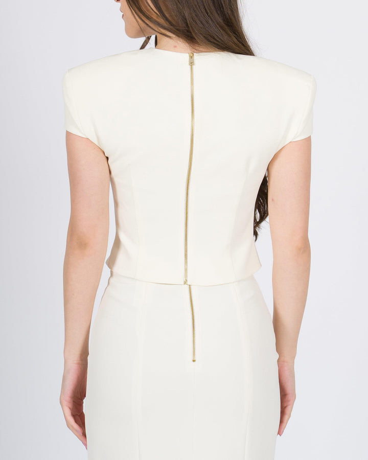 Blusa accollata Silence in tessuto panna con zip oro sul retro 