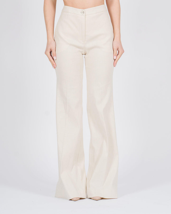 Pantaloni a zampa con finitura metallizzata panna 