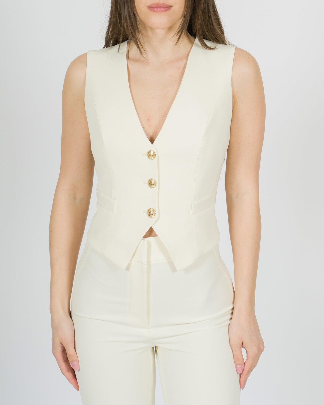 Gilet panna con bottoni oro 