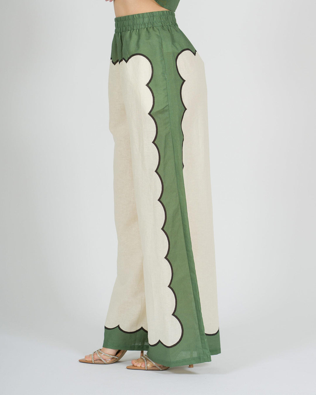 Pantalone panna in lino con stampa verde laterale 