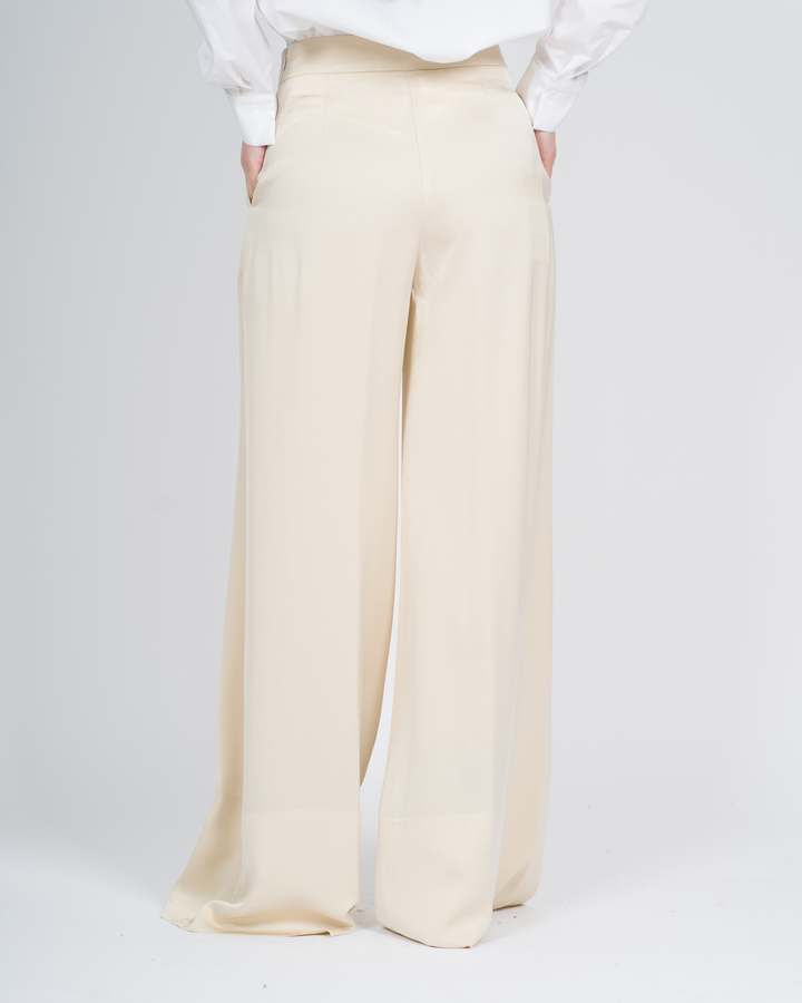 Pantaloni con cuciture decorative panna 