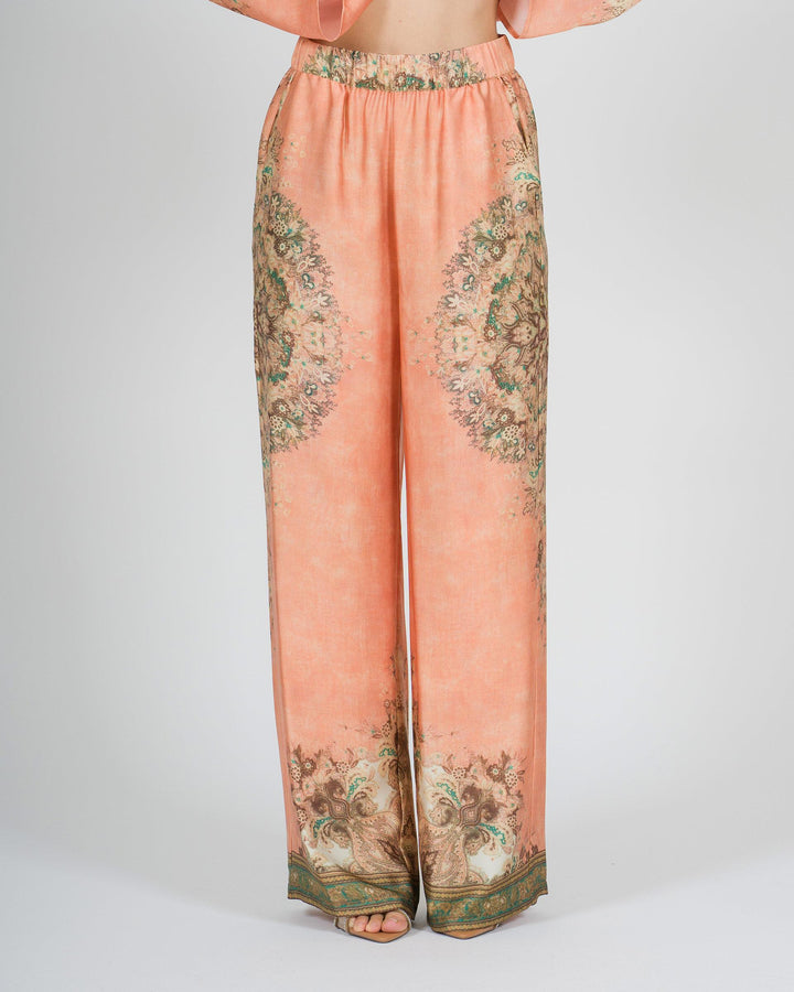 Pantalone amosa arancio in raso modello palazzo con stampa 