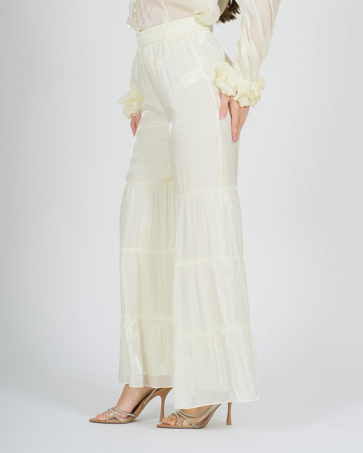 Pantalone panna amosa  modello zampa con balze 