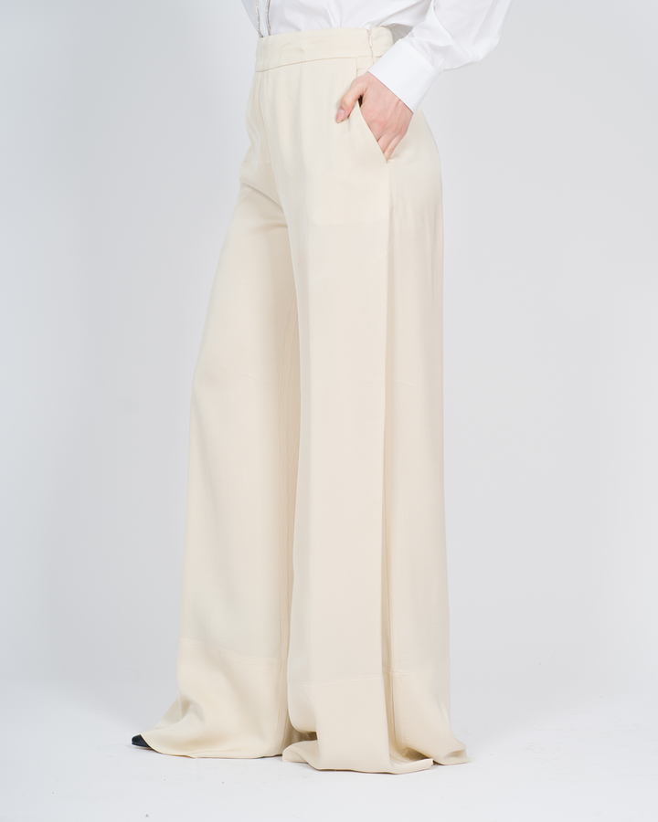 Pantaloni con cuciture decorative panna 