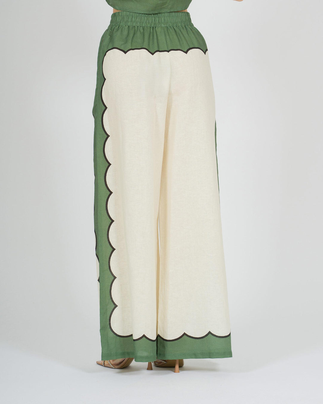 Pantalone panna in lino con stampa verde laterale 