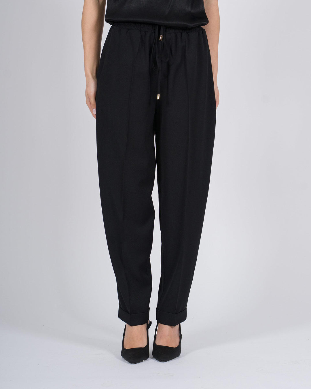 Pantaloni con vita elasticizzata e polsini nero 